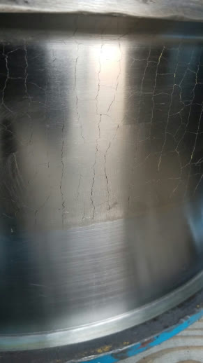 Close-up of a PK-503 submerged-arc hardsurfacing deposit showing the alloy's classic cracked finish